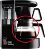 A black coffee maker with a glass carafe filled with coffee. Anteprima dell’immagine prodotto