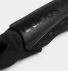 A close-up view of a black Adidas shin guard. Produktbild-Vorschau