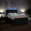 A bedroom scene with a bed, nightstands, lamps, and artwork. Náhled obrázku produktu