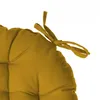 A close-up of a mustard yellow cushion with ties. Anteprima dell’immagine prodotto