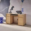 A modern wooden desk with drawers and shelves, set against a striking abstract mural. Produktbild-Vorschau