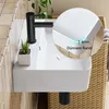 A close-up view of a white ceramic sink with a black faucet, featuring a magnified inset showing the thin rim of the sink. Anteprima dell’immagine prodotto