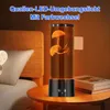 A jellyfish lamp is placed on a bedside table next to a bed. Produktbild-Vorschau