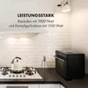 A modern kitchen scene featuring a white stovetop with a kettle and a black oven. Produktbild-Vorschau