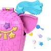 A close-up view of a pink piñata-shaped toy with various small accessories falling out of an open compartment. Náhled obrázku produktu