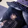 A close-up of a bedding set featuring Wednesday Addams under an umbrella in the rain. Produktbild-Vorschau