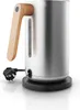 A close-up shot of a modern electric kettle with a stainless steel body, a wooden handle, and a black base. A power plug is visible connected to the base. Anteprima dell’immagine prodotto