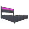 A bed with a headboard featuring LED lighting and shelves. Produktbild-Vorschau
