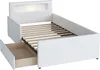 A white upholstered bed frame with a slatted mattress base and an open drawer. Produktbild-Vorschau
