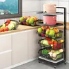 A kitchen scene with a multi-tiered rolling cart filled with fruits and vegetables, alongside kitchen appliances. Produktbild-Vorschau