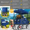 A blue KESSER outdoor wagon filled with items, with a child holding a teddy bear next to it, set against a mountainous backdrop. Produktbild-Vorschau