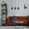 A living room scene with a sofa, coffee table, and shelving unit. Náhľad obrázku produktu