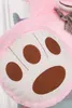Close-up of a pink teddy bear's paw with brown paw pads and stitching. Podgląd zdjęcia produktu