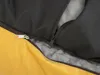 A close-up view of a zipper on a yellow and black dog bed. Náhľad obrázku produktu