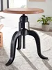 A close-up shot of an adjustable height stool with a wooden seat and a black metal base. Produktbild-Vorschau