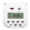 A white digital timer with a digital display and buttons. Voir les images du produit