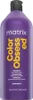 A studio shot of a large purple bottle of Matrix Total Results Color Obsessed Shampoo. Produktbild-Vorschau
