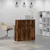 A reception desk with a chair and a bookshelf in an office setting. Anteprima dell’immagine prodotto