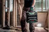 A person holding a Metabo radio in a construction site. Podgląd zdjęcia produktu
