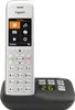 A white Gigaset cordless phone is shown in its charging base against a white background. Podgląd zdjęcia produktu