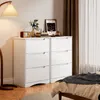A bedroom scene with two white dressers, a lamp, and a bed. Podgląd zdjęcia produktu