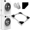 A stacked washing machine and dryer set, a ratchet strap, and a movable appliance base are displayed against a white background. Produktbild-Vorschau
