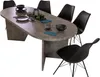 A dining table with chairs set up for a meal. Produktbild-Vorschau