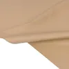 A close-up view of a piece of sand beige faux leather fabric, folded and draped. Náhled obrázku produktu