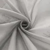 A close-up of a gray sheer fabric, likely a curtain, swirled into a spiral. Produktbild-Vorschau