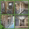 A collage of four images showing different views of a wooden aviary or pigeon coop. Voir les images du produit
