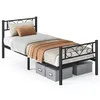 A black metal twin-size bed frame with a headboard and footboard, complete with bedding and two storage boxes underneath. Náhled obrázku produktu