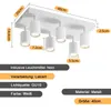 A white ceiling light fixture with six adjustable spotlights, shown with dimensions and product specifications. Produktbild-Vorschau