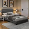 A bedroom scene featuring a bed, nightstands, and artwork. Anteprima dell’immagine prodotto