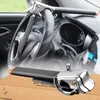 A steering wheel lock is shown installed in a car and also separately on a cardboard box. Náhľad obrázku produktu