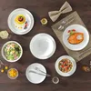 A beautifully set table with various dishes and cutlery, suggesting a meal setting. Produktbild-Vorschau