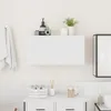 A white wall-mounted bathroom cabinet with various toiletries and towels displayed around it. Produktbild-Vorschau