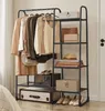 A clothing rack with shelves displaying clothes, bags, hats, and shoes. Produktbild-Vorschau
