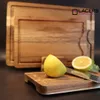 A set of wooden cutting boards with lemons and a knife. Produktbild-Vorschau