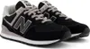 A pair of black New Balance 574 sneakers. Voir les images du produit