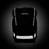 A black Ergobag cubo light backpack with reflective strips is shown against a dark, gradient background. Produktbild-Vorschau