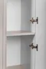 Close-up view of the interior of a cabinet, showing shelves and hinges. Voir les images du produit