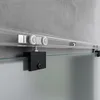 A close-up view of a sliding glass door track and roller system mounted on a concrete wall. Produktbild-Vorschau