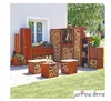 An outdoor patio scene with various corten steel garden furniture and accessories, including a firewood storage unit, planter boxes, and seating cubes, set against a white house wall and green lawn. Produktbild-Vorschau