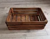 A wooden crate is placed on a wooden floor. Náhled obrázku produktu