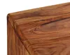 A close-up view of the corner of a wooden desk. Produktbild-Vorschau