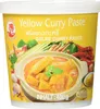 A container of yellow curry paste with an image of curry and ingredients on the front. Voir les images du produit