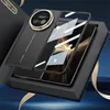 A black smartphone case with a gold accent is displayed in a black box, with gold ribbons. Produktbild-Vorschau