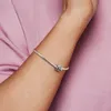 A close-up shot of a person's arm wearing a silver bracelet with a charm. Anteprima dell’immagine prodotto
