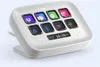 A white Elgato Stream Deck Neo device with 8 programmable buttons and a small display screen showing the date and time. Náhled obrázku produktu