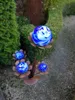 A garden decoration with glass spheres resembling flowers. Anteprima dell’immagine prodotto